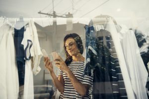 Shot of a shopper using her cellphone while looking at a price tagimage806285.jpg
